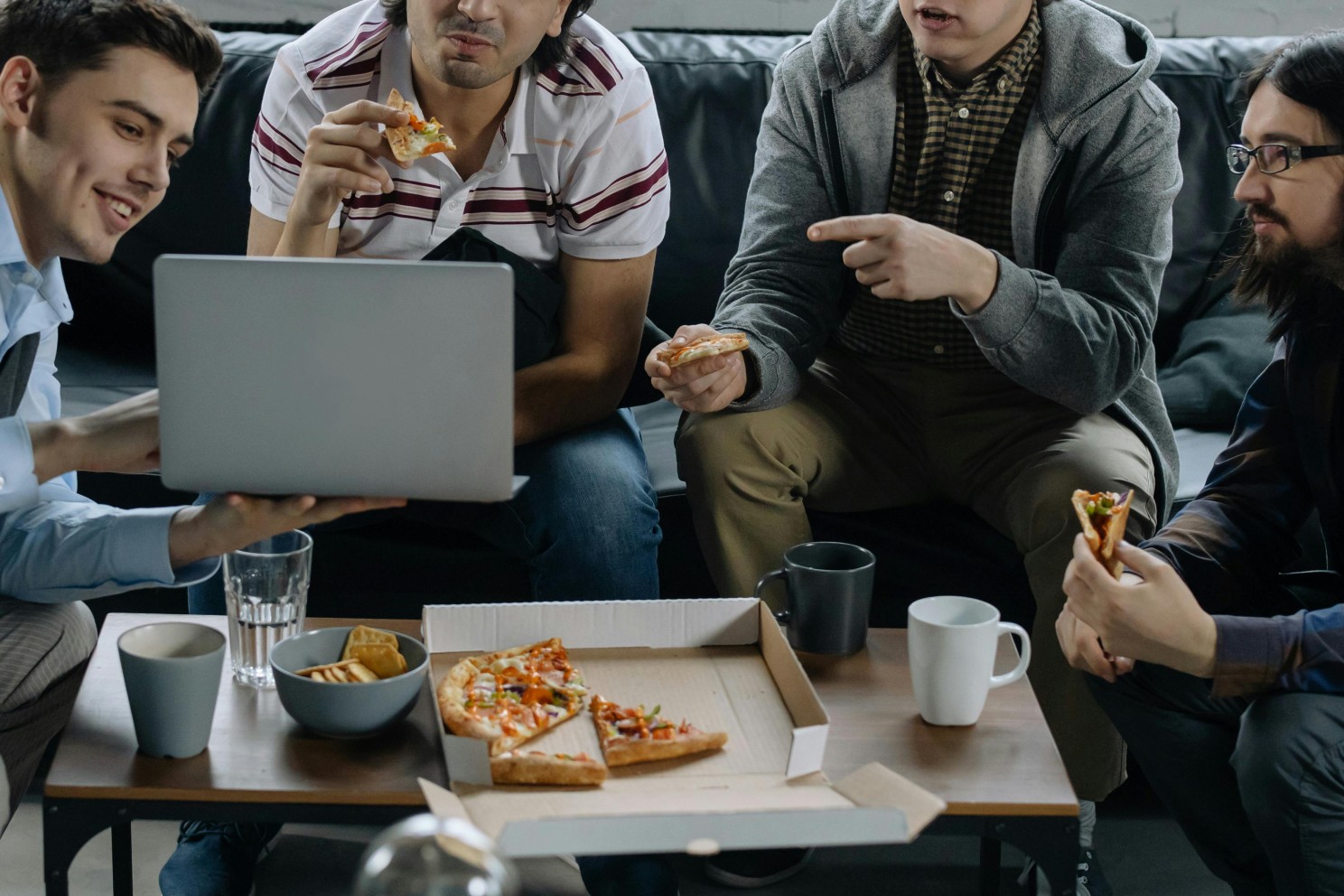 Team eating pizza