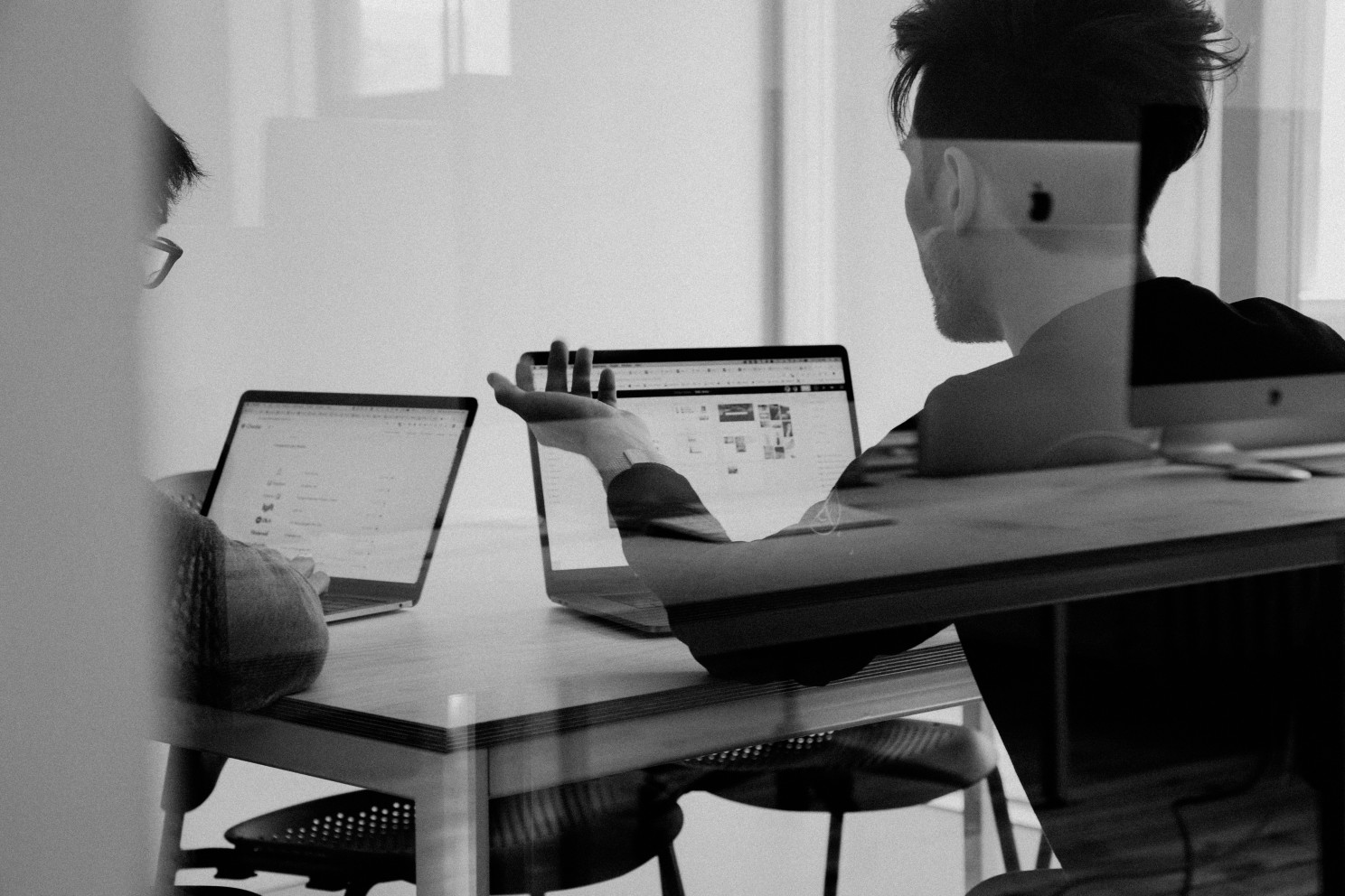 Two employees discussing Two employees discussing